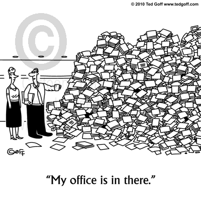 Office Cartoon # 6752: Gesturing to mountain of clutter: My office is in there.